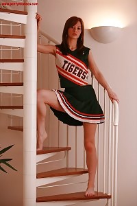 Cheerleader Adalynn Exhibits Her Slender Body On The Stairs