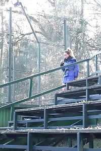 Black-haired Squats Low To Pee Outside