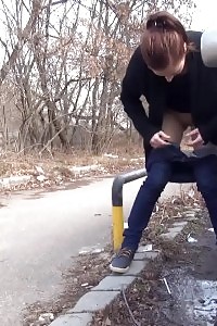 Brunette Slut Squats Near A Car To Pee Outside