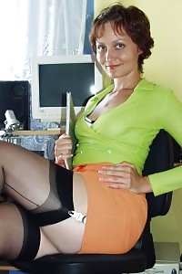 Kirsty Blue Plays With Her Sexy Legs At The Computer Table