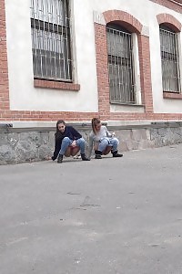 Brunette Ladies Piss In The City At Same Time