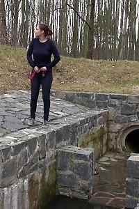 Antonia Pissing Outside Next To Drainage Pipe
