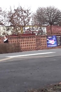 Black-haired Bitch Needs To Piss While Walking By A Road