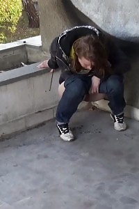 Delightful Babe In Denims Pisses Onto The Concrete