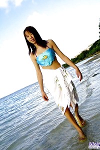 Asian Dick Tease Enjoys Running Nude On The Beach And Having Fun In The Water